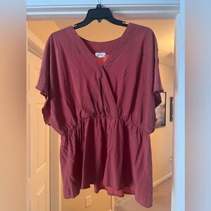 Peplum top with snap closure